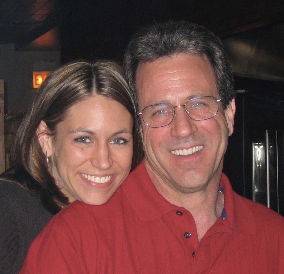 Melissa and Bill smiling together.