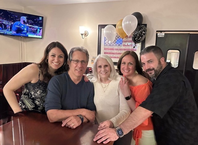 Bill with his family gathered together.